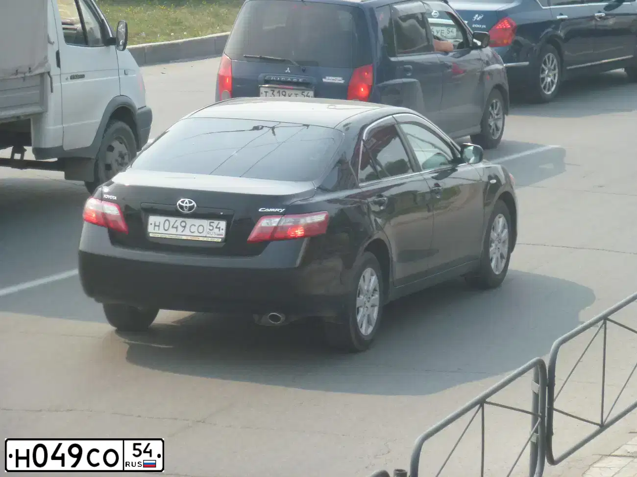 Фото автомобиля TOYOTA CAMRY, 2007 — госномер Н049СО54. Цвет: ЧЕРНЫЙ