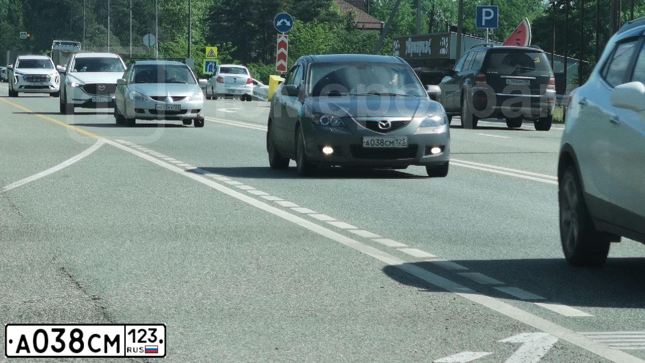 Фото автомобиля MAZDA 3, 2007 — госномер К999СК23. Цвет: СЕРЫЙ