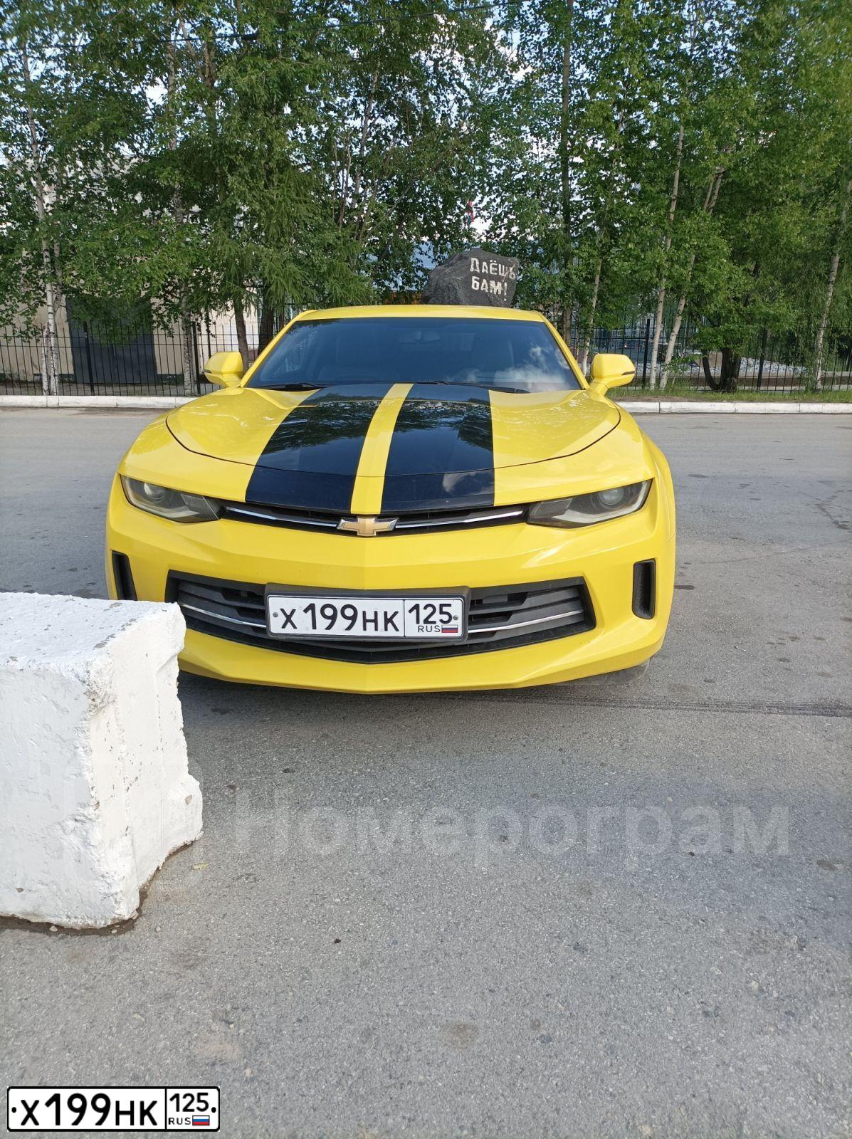 Фото автомобиля CHEVROLET CAMARO, 2016 — госномер Е754ОМ28. Цвет: ЖЕЛТЫЙ