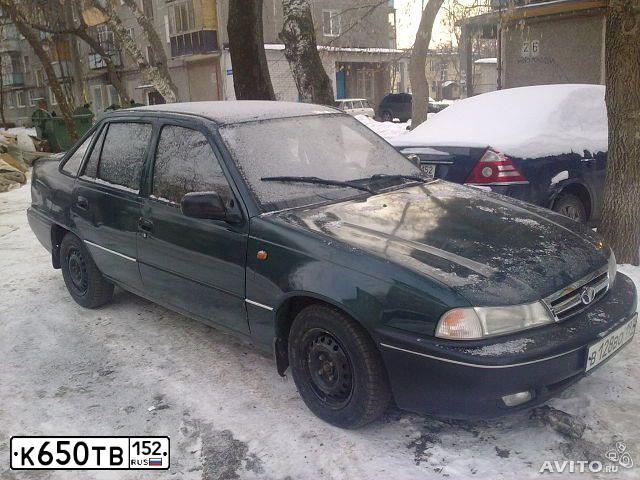 Фото автомобиля DAEWOO NEXIA, 1997 — госномер В215ТН77. Цвет: ТЕМНО-ЗЕЛЕНЫЙ