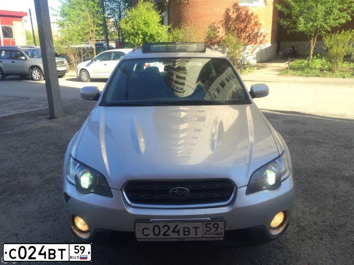 Фото автомобиля SUBARU OUTBACK, 2006 — госномер Е189НА196. Цвет: Серебристый