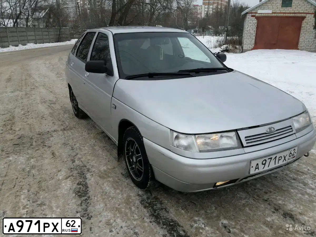 Фото автомобиля LADA 2112, 2005 — госномер Р927УЕ62. Цвет: СЕРЫЙ МЕТАЛЛИК