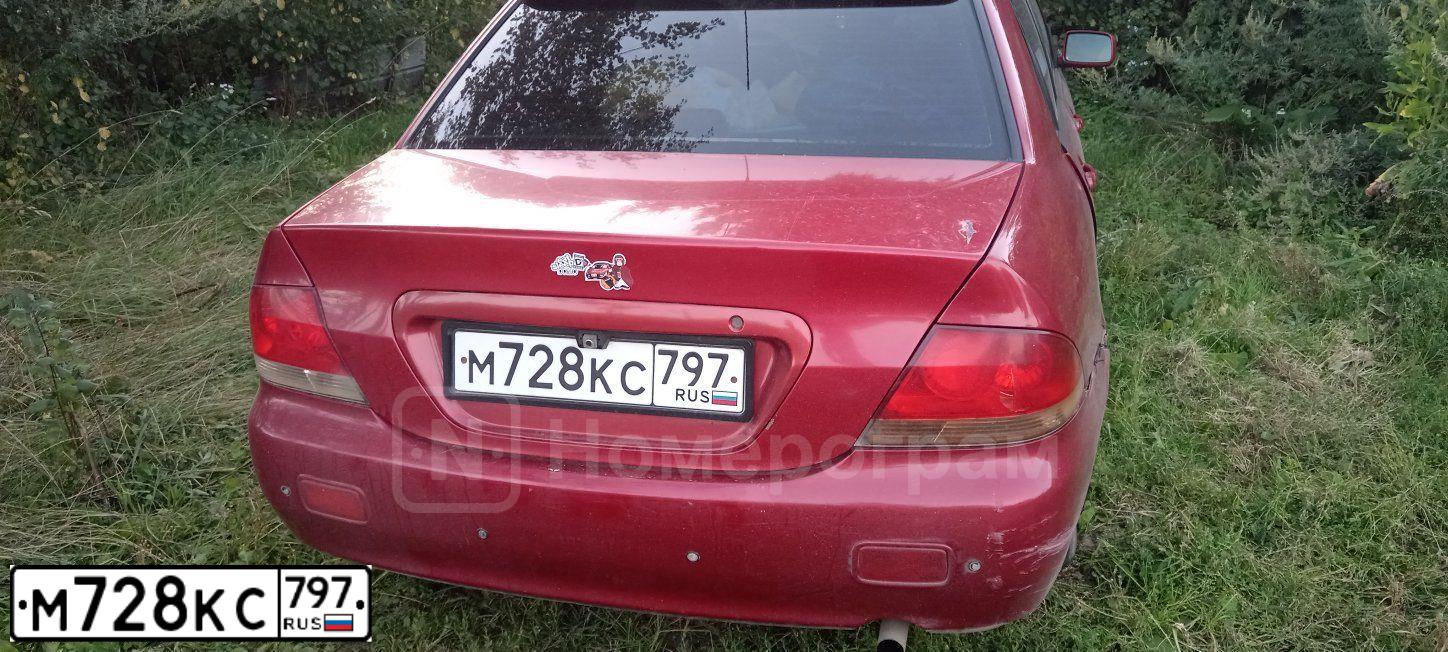 Фото автомобиля MITSUBISHI LANCER, 2005 — госномер М728КС797. Цвет: Красный