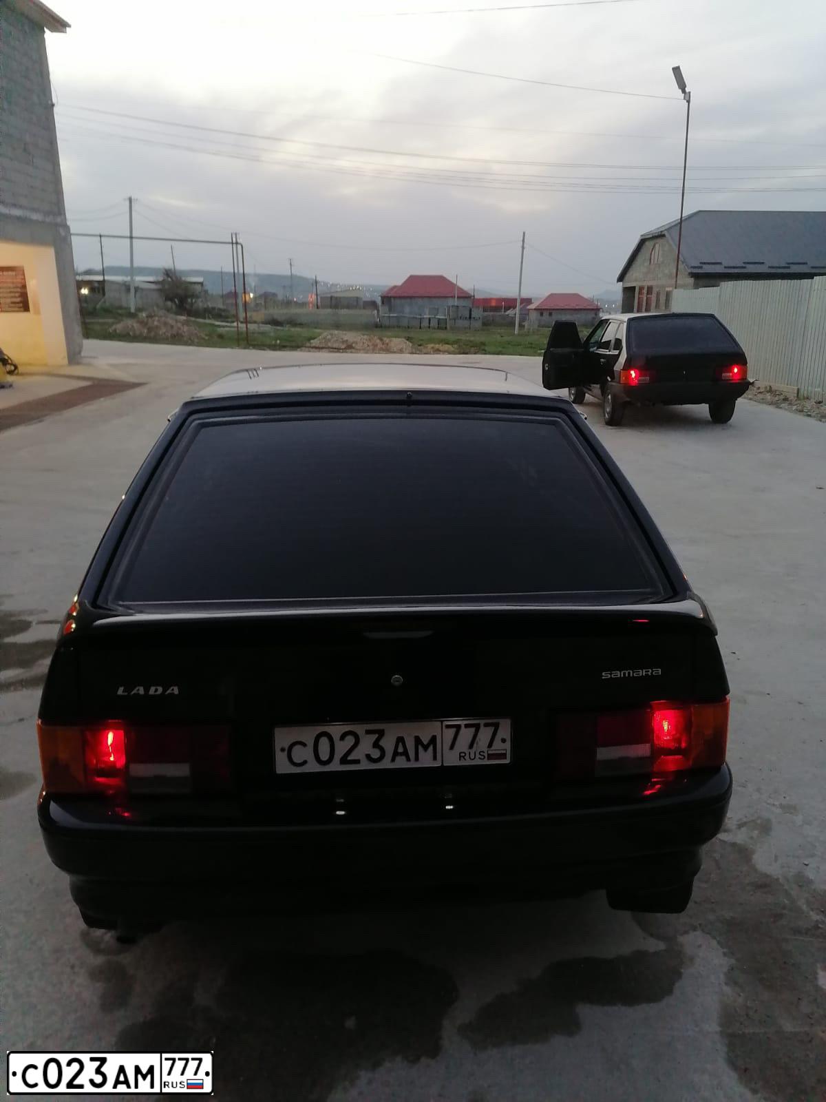 Фото автомобиля LADA 2114 SAMARA, 2010 — госномер С023АМ777. Цвет: Сине-Черный