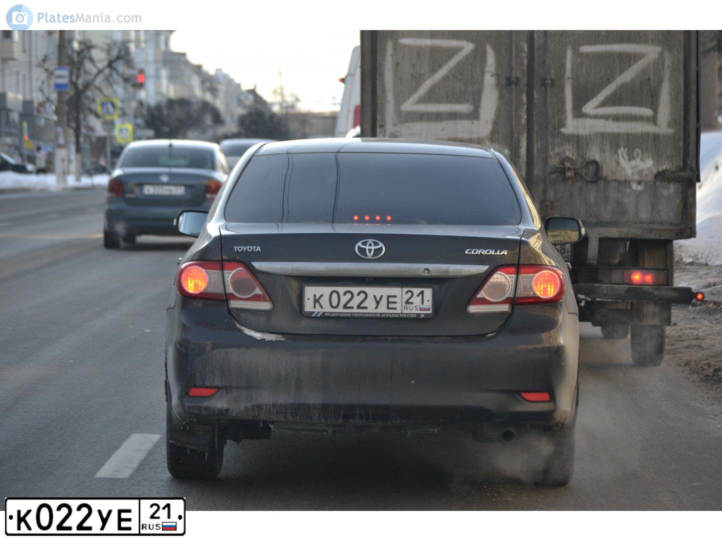 Фото автомобиля TOYOTA COROLLA, 2011 — госномер К022УЕ21. Цвет: ЧЕРНЫЙ