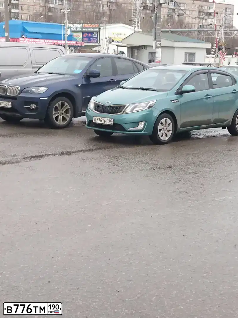 Фото автомобиля KIA RIO, 2012 — госномер А248УХ252. Цвет: Светло-зеленый
