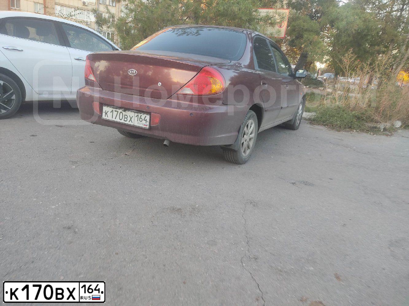 Фото автомобиля KIA SPECTRA, 2006 — госномер К170ВХ164. Цвет: Красный