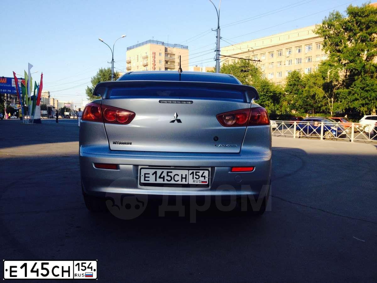 Фото автомобиля MITSUBISHI LANCER, 2008 — госномер Е145СН154. Цвет: серебристый