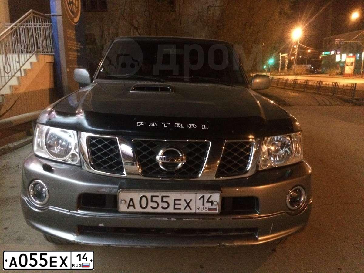 Фото автомобиля NISSAN PATROL, 2007 — госномер А074МЕ14. Цвет: СЕРЫЙ