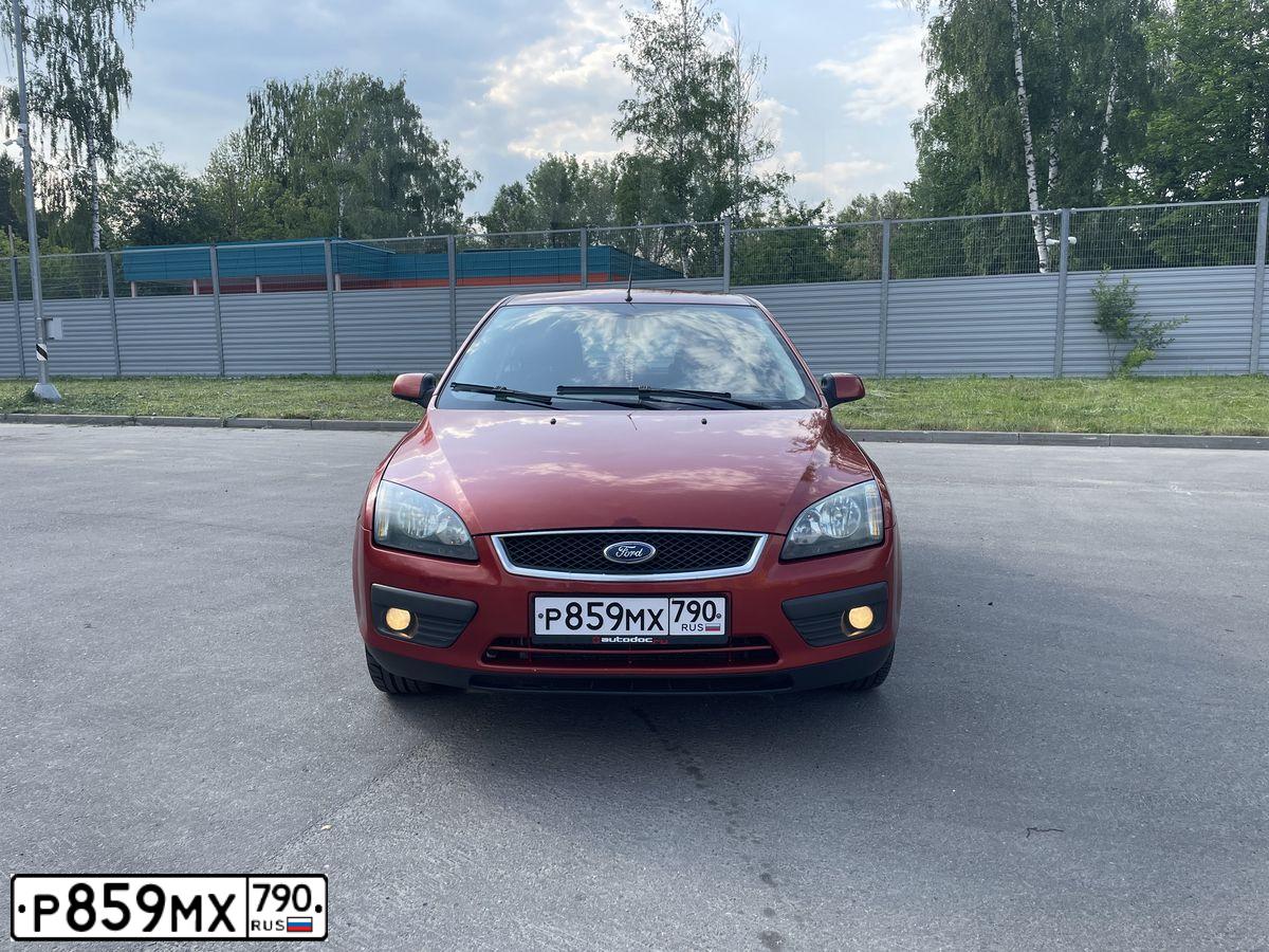 Фото автомобиля FORD FOCUS, 2006 — госномер В605РЕ790. Цвет: КРАСНО-ОРАНЖЕВЫЙ