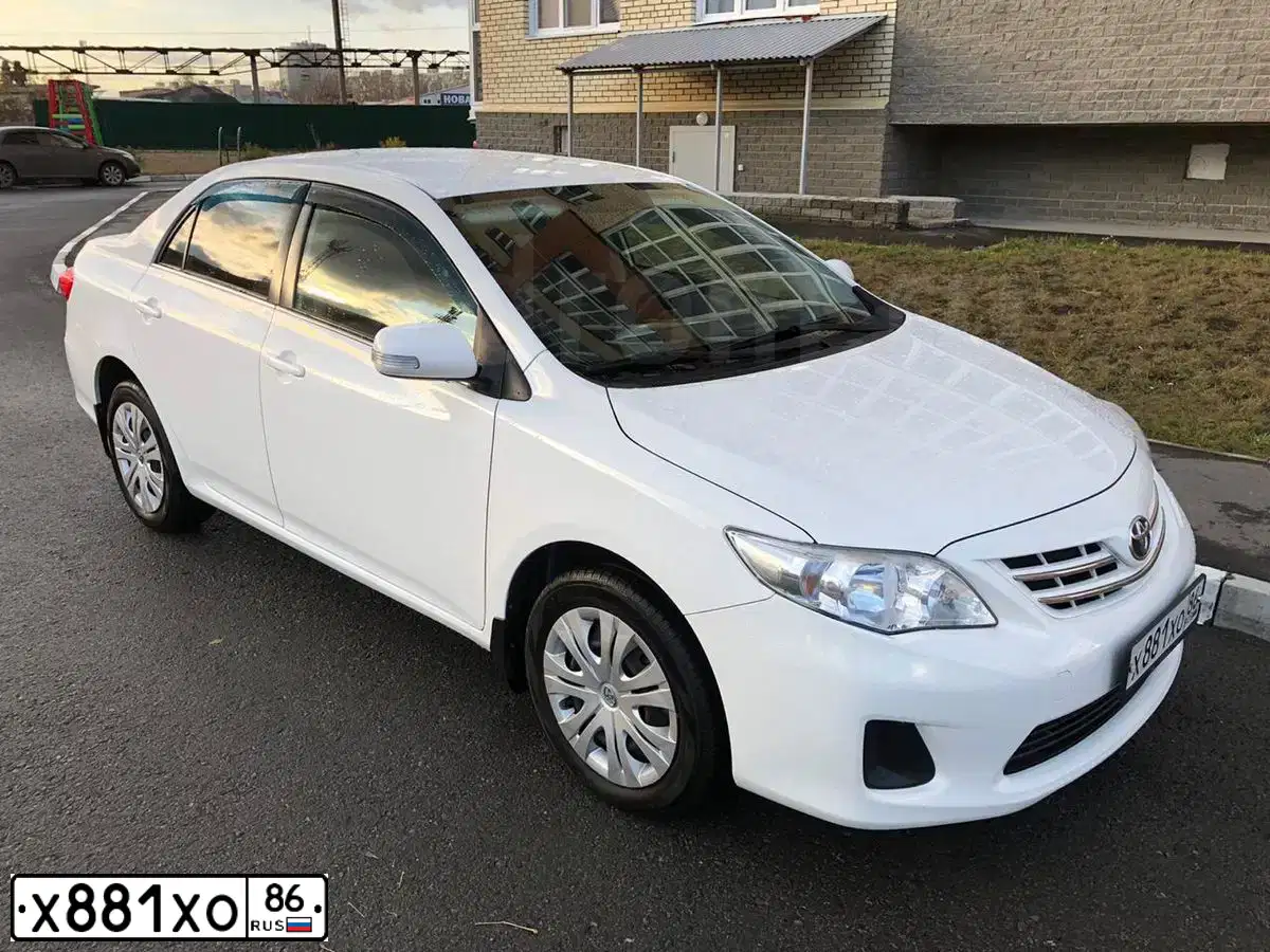 Фото автомобиля TOYOTA COROLLA, 2011 — госномер Х169НТ55. Цвет: Белый