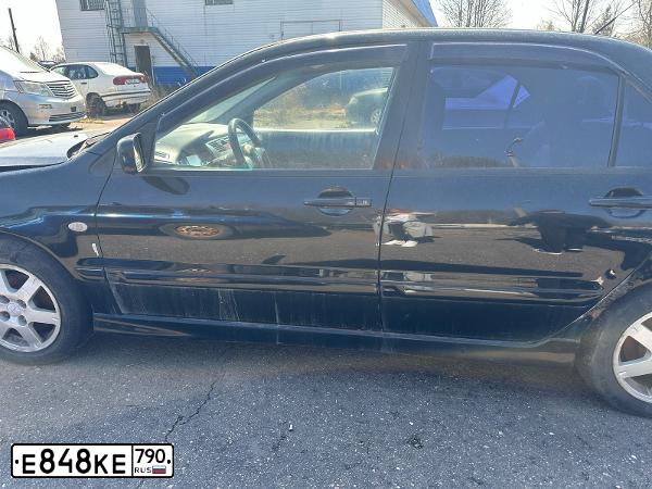 Фото автомобиля MITSUBISHI LANCER, 2006 — госномер Е848КЕ790. Цвет: ЧЕРНЫЙ