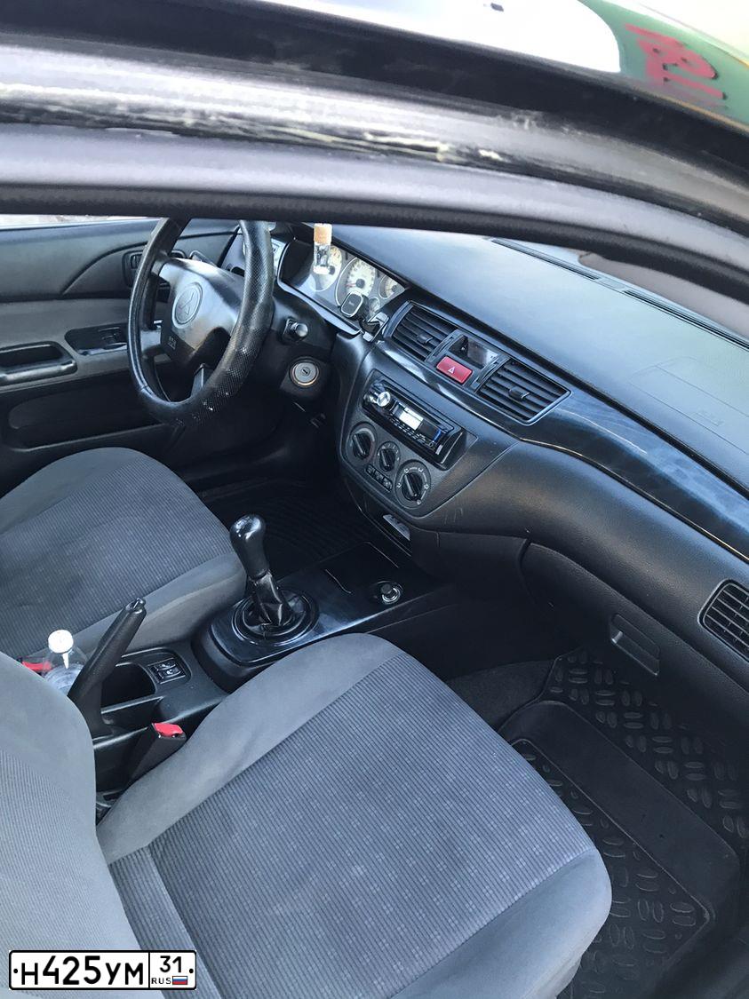 Фото автомобиля MITSUBISHI LANCER, 2005 — госномер А571МО193. Цвет: ЧЕРНЫЙ
