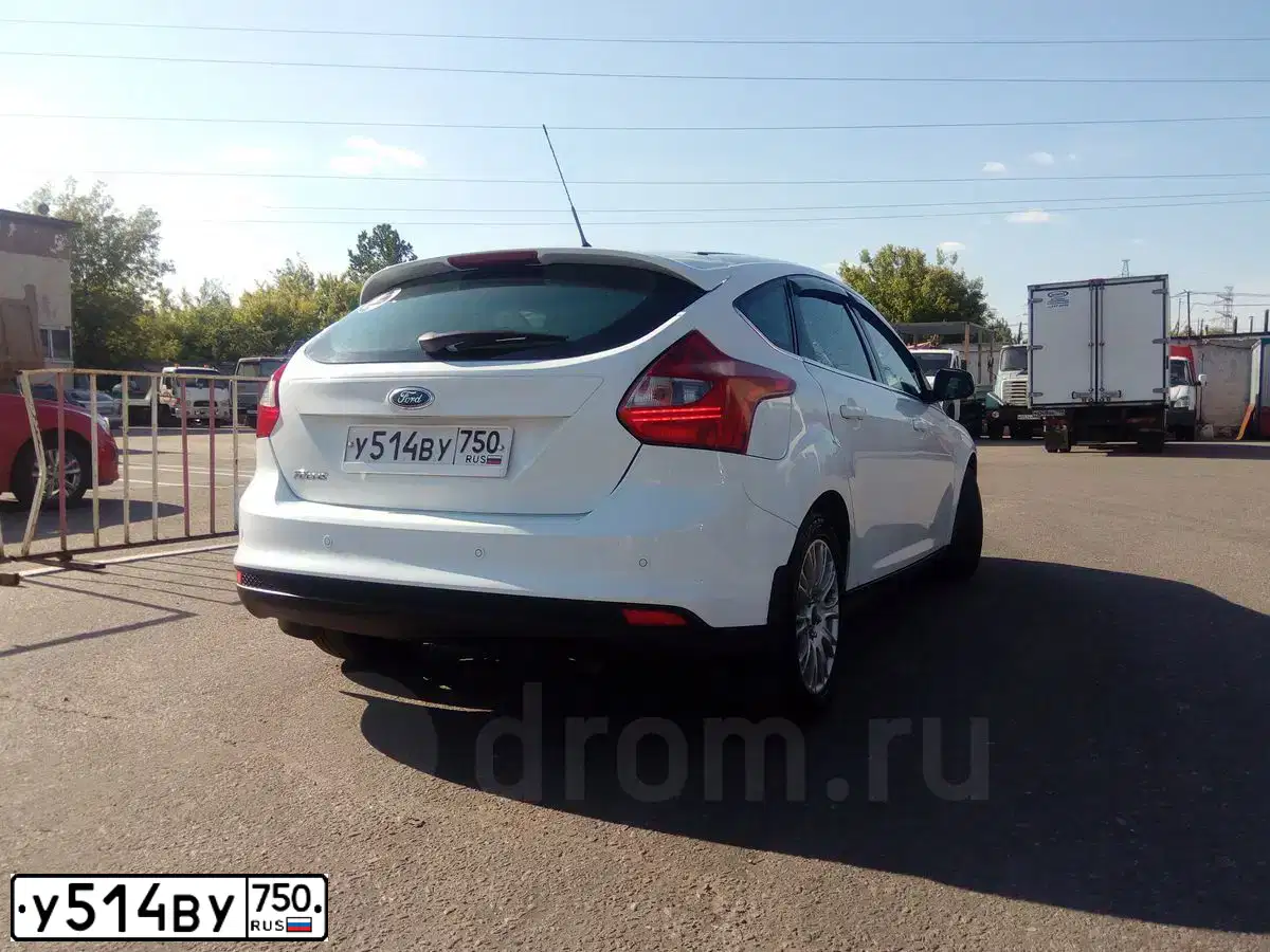 Фото автомобиля FORD FOCUS, 2012 — госномер Е029УЕ82. Цвет: Белый
