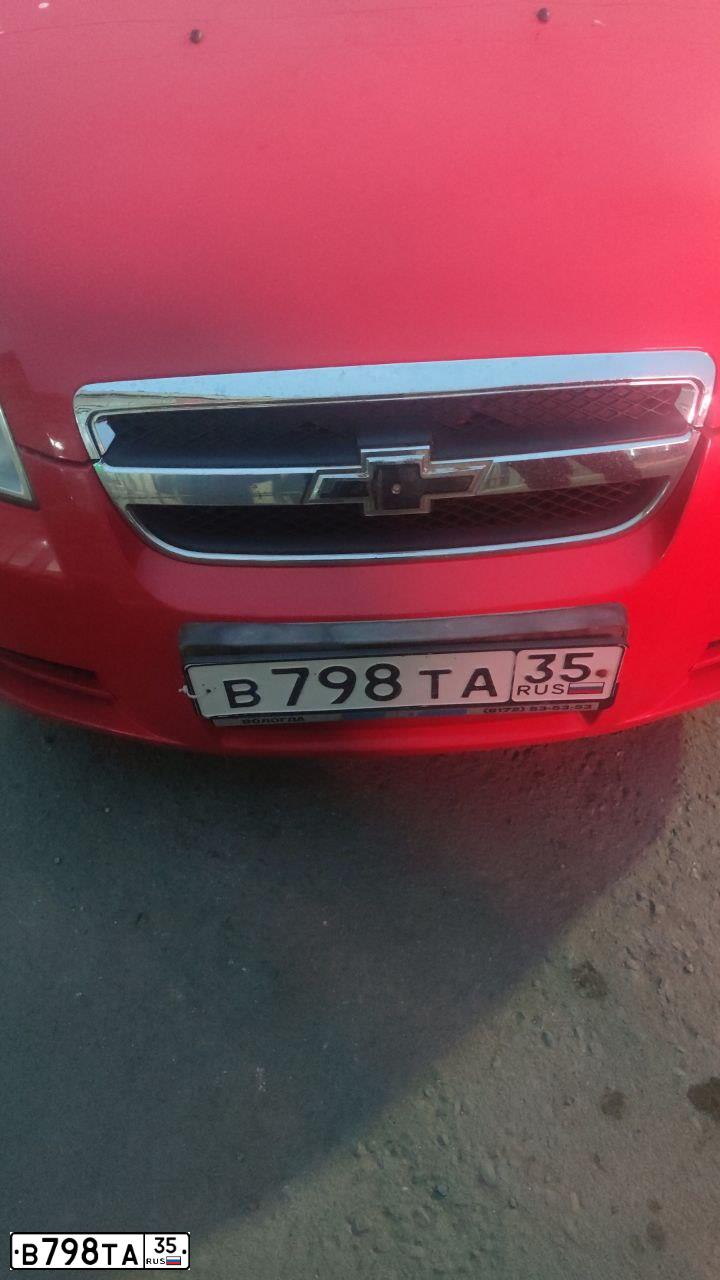 Фото автомобиля CHEVROLET AVEO, 2007 — госномер К878КН761. Цвет: Красный