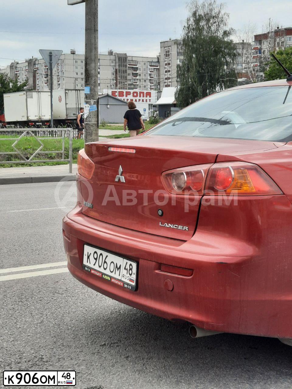 Фото автомобиля MITSUBISHI LANCER, 2008 — госномер К906ОМ48. Цвет: КРАСНЫЙ