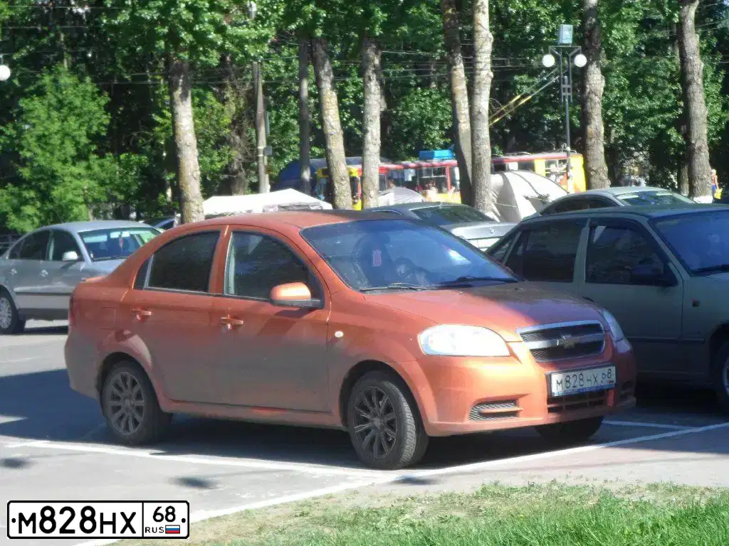 Фото автомобиля CHEVROLET AVEO, 2007 — госномер Р338МУ68. Цвет: Оранжевый
