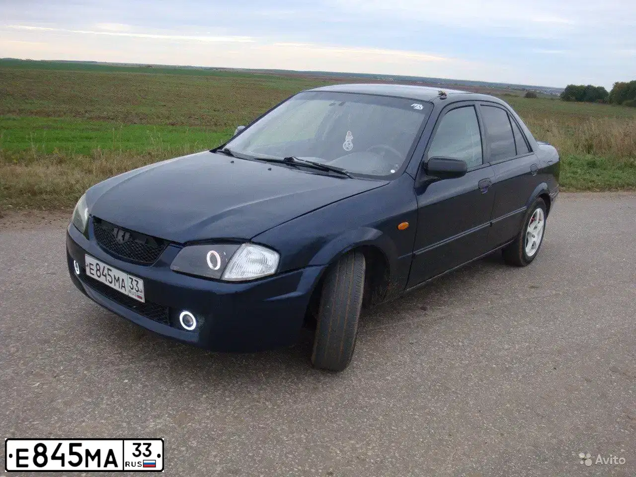 Фото автомобиля MAZDA 323, 1998 — госномер А297НХ67. Цвет: СИНИЙ