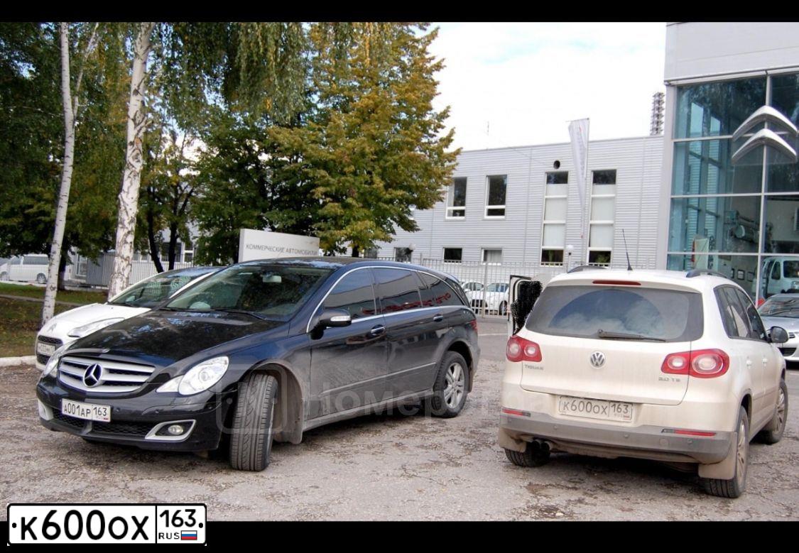 Фото автомобиля VOLKSWAGEN TIGUAN, 2009 — госномер В647ОВ156. Цвет: Белый