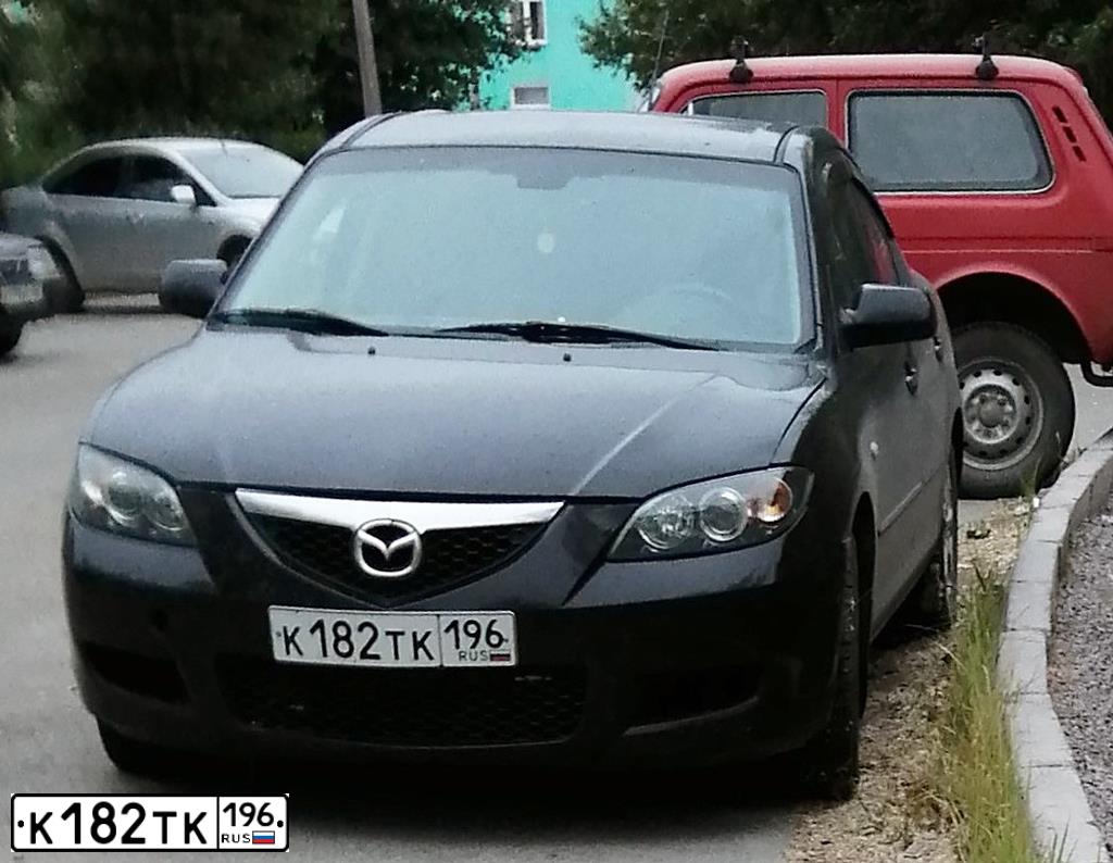 Фото автомобиля MAZDA 323, 2008 — госномер О284НО138. Цвет: ЧЕРНЫЙ