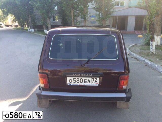Фото автомобиля LADA 2121 NIVA, 2012 — госномер О580ЕА72. Цвет: ТЕМНО-ВИШНЕВЫЙ