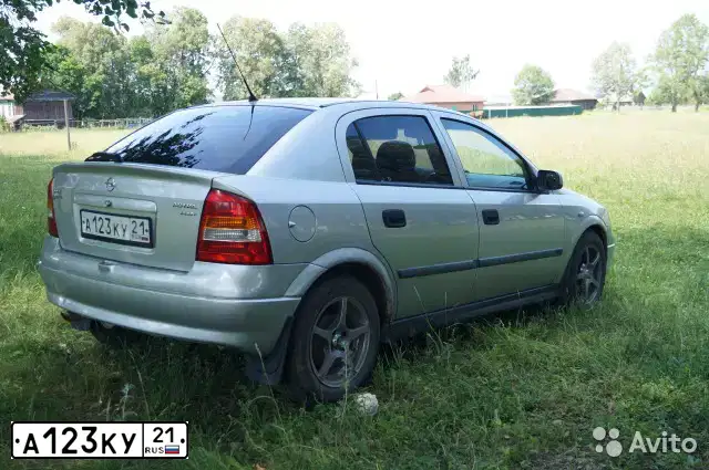 Фото автомобиля OPEL ASTRA, 2000 — госномер А123КУ21. Цвет: БЕЛЫЙ (СЕРЕБРИСТЫЙ)
