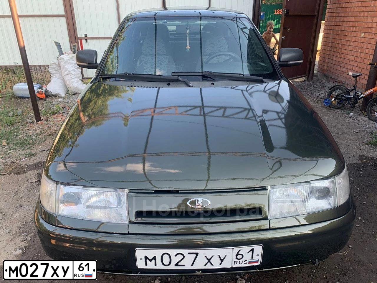 Фото автомобиля LADA 2112 LADA, 2005 — госномер М027ХУ61. Цвет: ЗОЛОТИСТЫЙ ТЕМНО-ЗЕЛЕНЫЙ