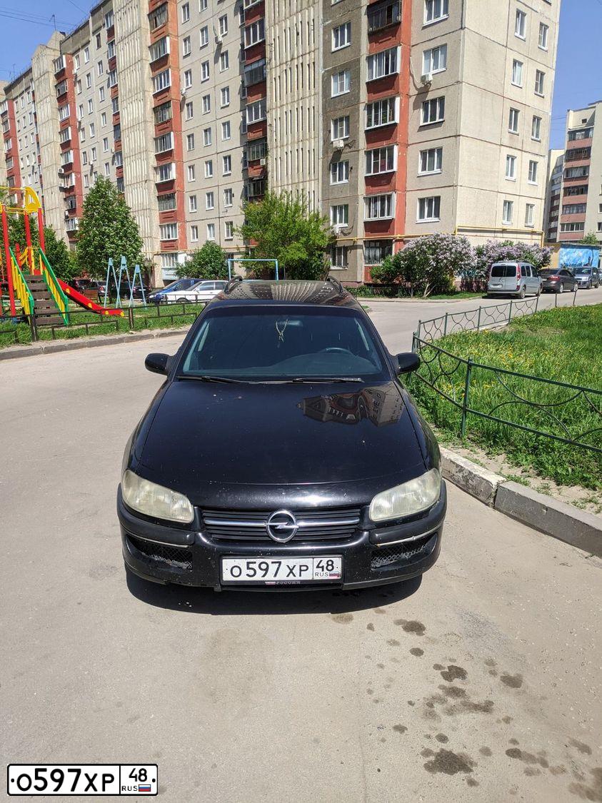 Фото автомобиля OPEL OMEGA, 1997 — госномер Р905ВА48. Цвет: ЧЕРНЫЙ