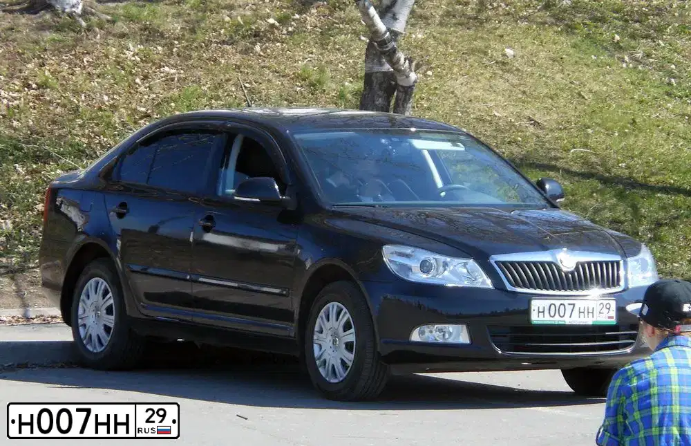 Фото автомобиля SKODA OCTAVIA, 2011 — госномер Н007НН29. Цвет: ЧЕРНЫЙ