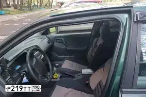 Фото автомобиля NISSAN PRIMERA, 1998 — госномер Р219ТТ190. Цвет: ЗЕЛЕНЫЙ