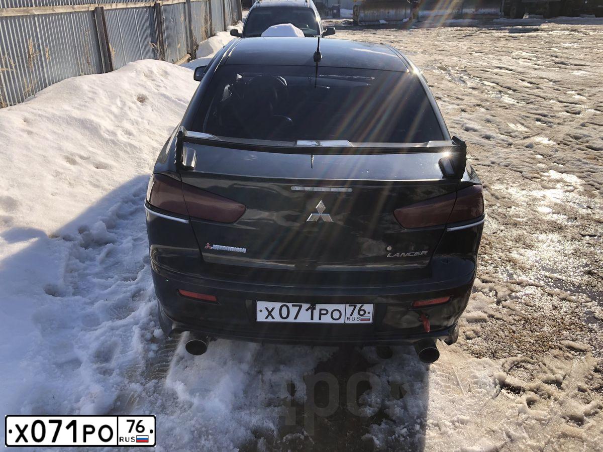 Фото автомобиля MITSUBISHI LANCER, 2008 — госномер М932РТ134. Цвет: ЧЕРНЫЙ