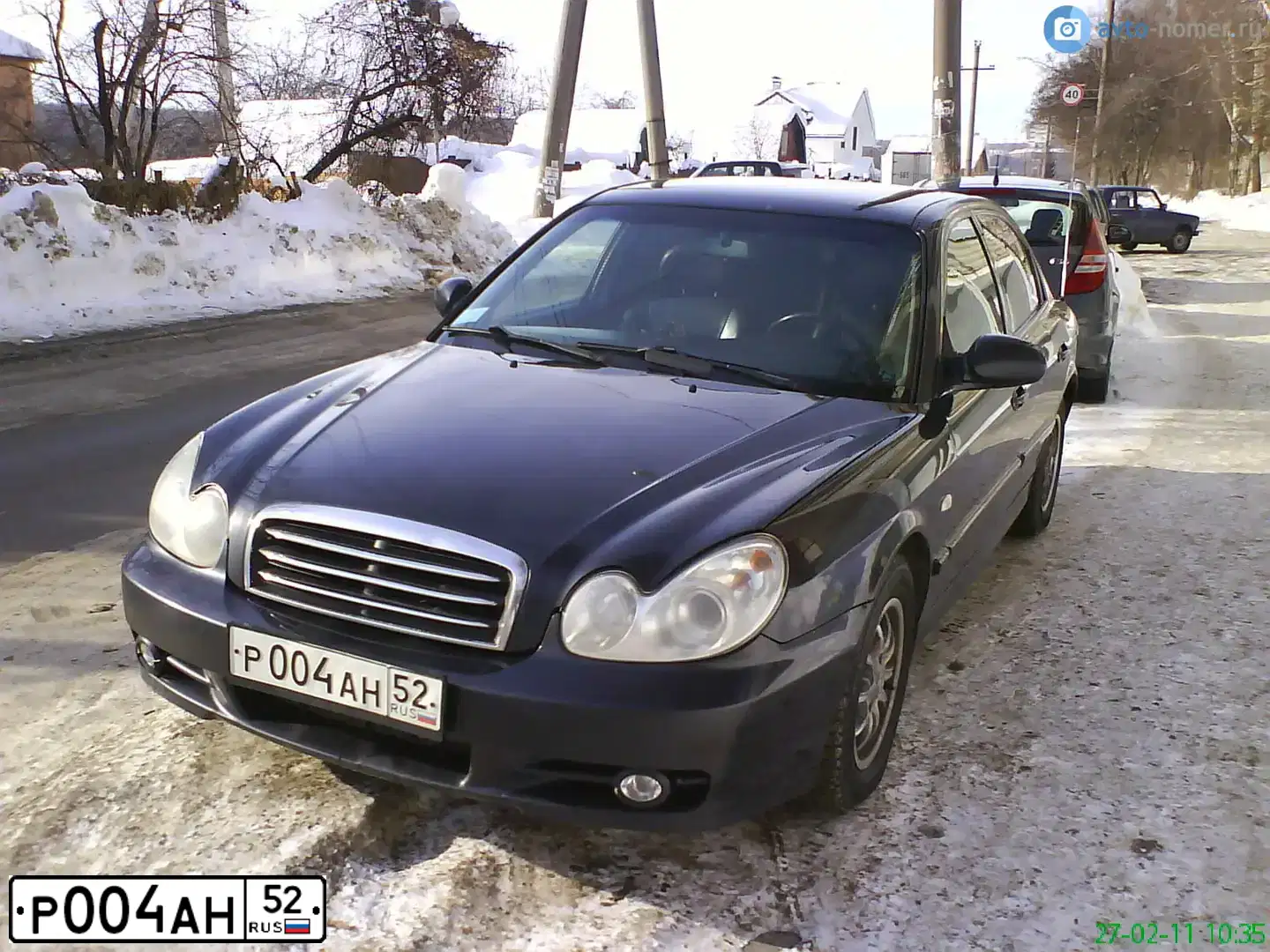Фото автомобиля TAGAZ SONATA, 2004 — госномер Р004АН52. Цвет: ЧЕРНЫЙ