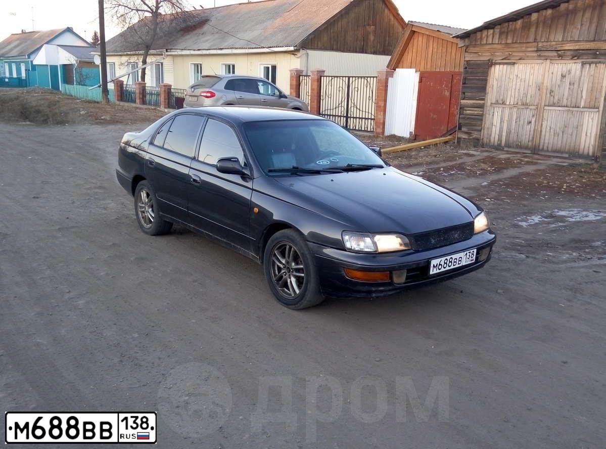 Фото автомобиля TOYOTA CARINA, 1997 — госномер М688ВВ138. Цвет: ЧЕРНЫЙ
