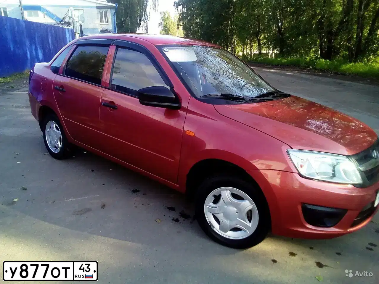 Фото автомобиля LADA 2190 GRANTA, 2014 — госномер У877ОТ43. Цвет: Оранжевый