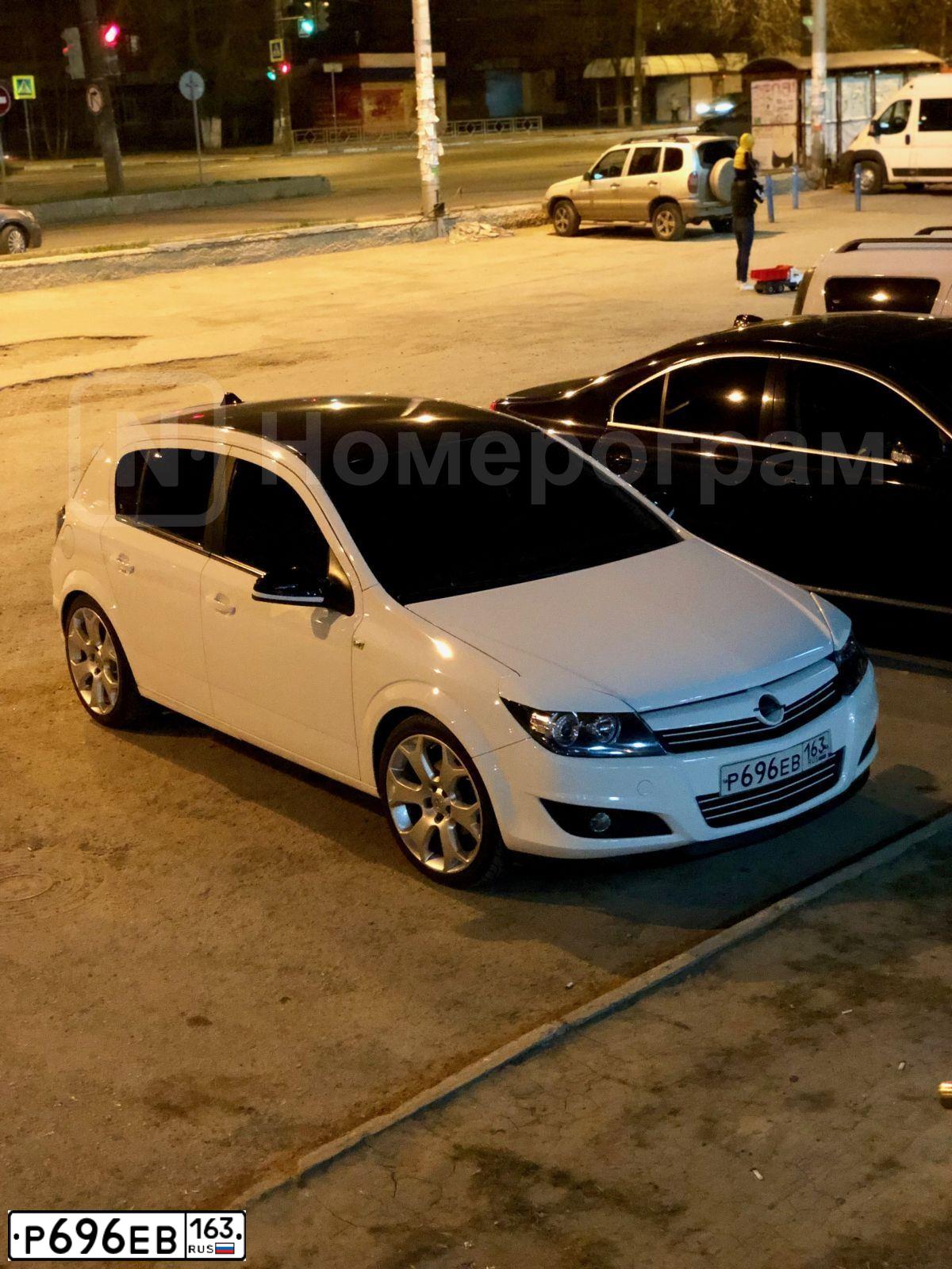 Фото автомобиля OPEL ASTRA, 2012 — госномер Р696ЕВ163. Цвет: Белый
