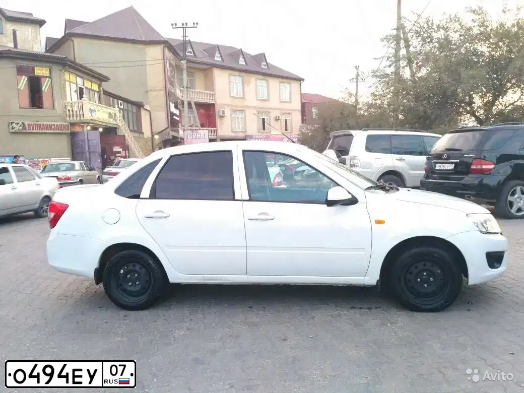Фото автомобиля LADA GRANTA, 2013 — госномер У184КТ05. Цвет: Белый