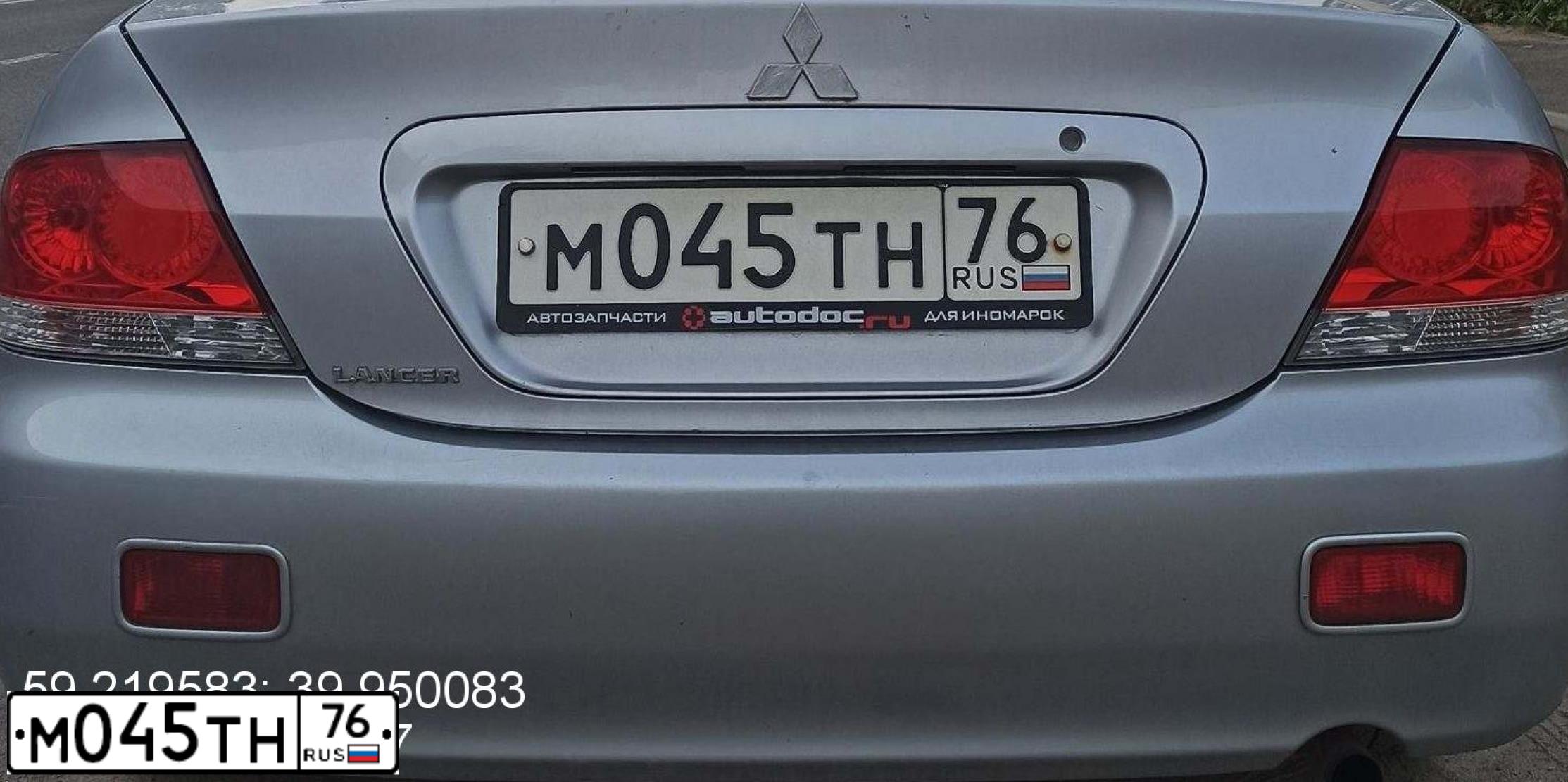 Фото автомобиля MITSUBISHI LANCER, 2006 — госномер М045ТН76. Цвет: СВЕТЛО-СЕРЫЙ