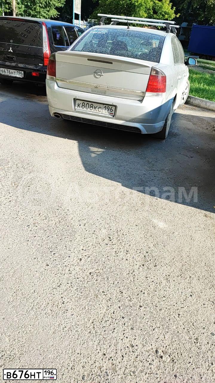 Фото автомобиля MITSUBISHI LANCER, 2005 — госномер В676НТ196. Цвет: ЧЕРНЫЙ