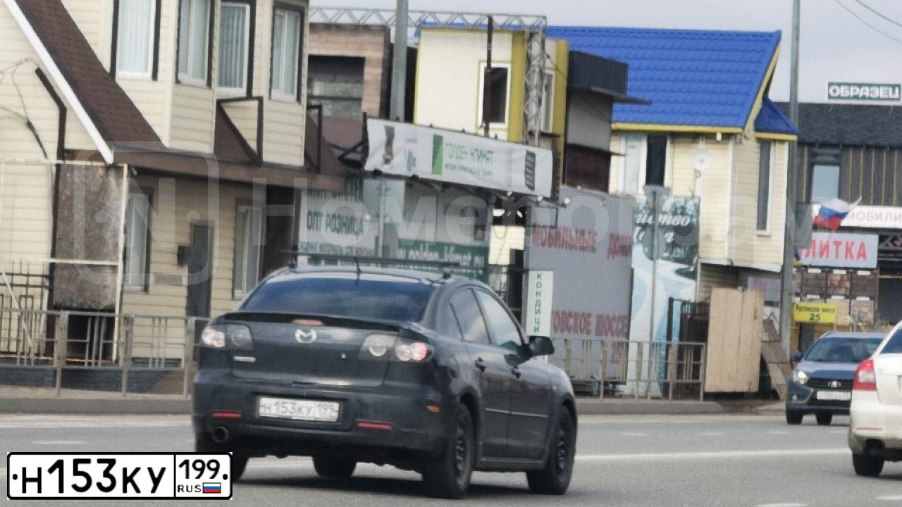 Фото автомобиля MAZDA 3, 2008 — госномер Н153КУ199. Цвет: ЧЕРНЫЙ