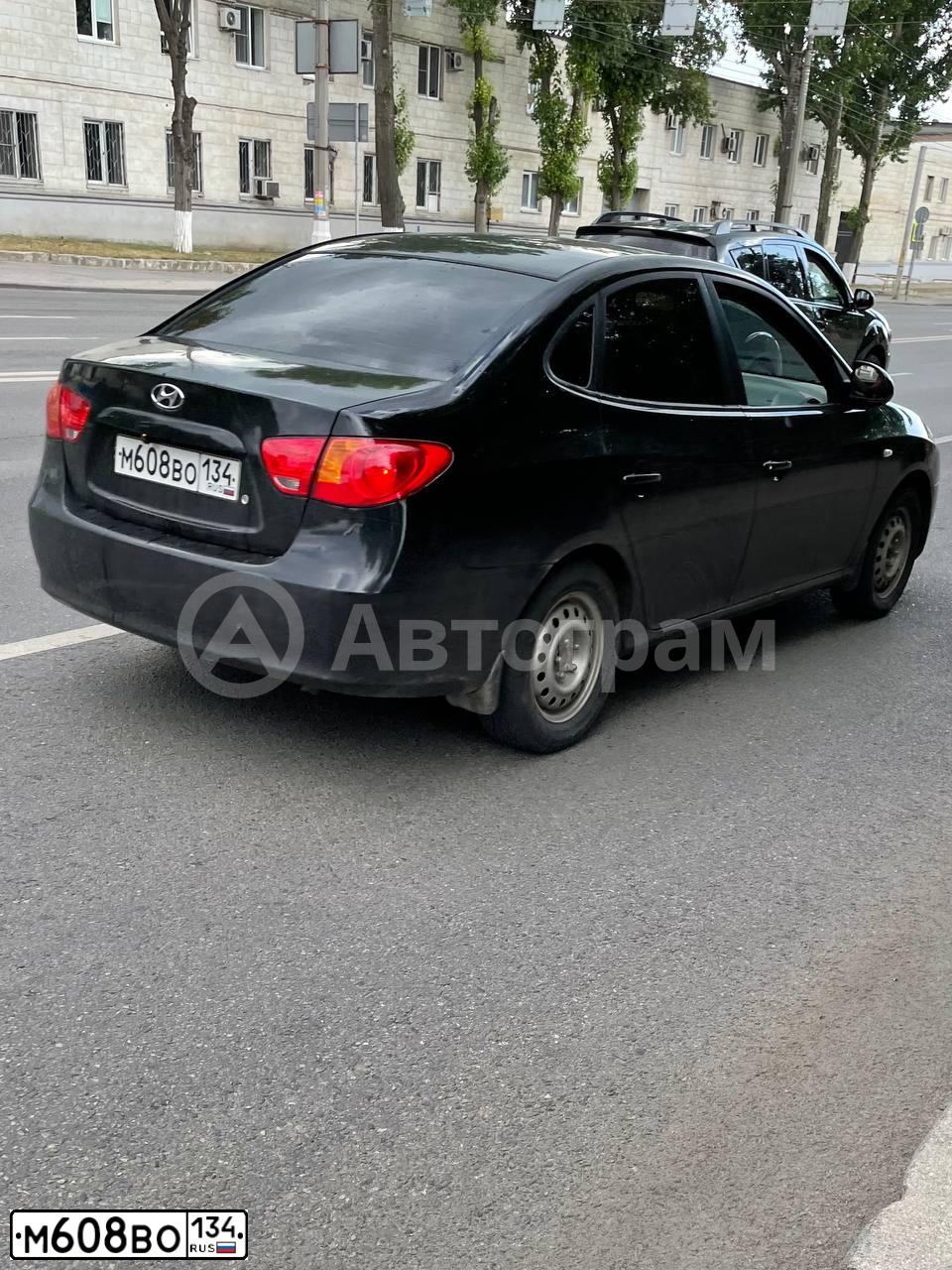 Фото автомобиля HYUNDAI ELANTRA, 2008 — госномер Е134АУ134. Цвет: ЧЕРНЫЙ