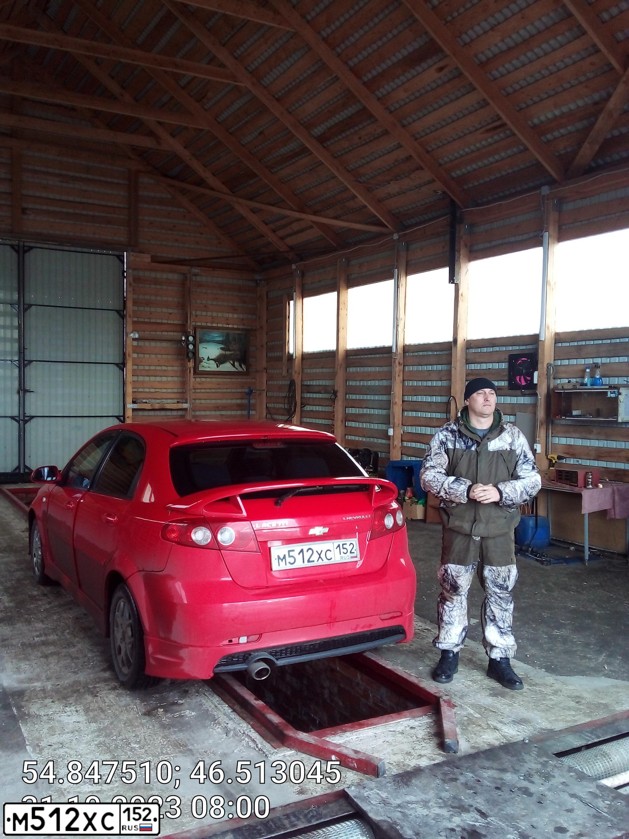 Фото автомобиля CHEVROLET LACETTI, 2007 — госномер М512ХС152. Цвет: Красный