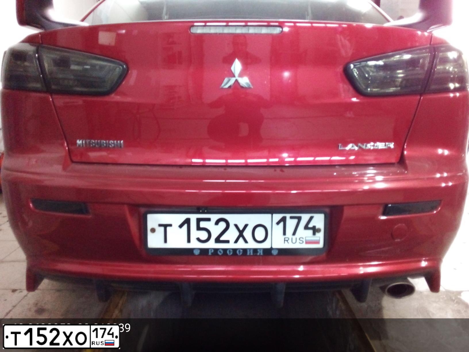 Фото автомобиля MITSUBISHI LANCER, 2008 — госномер Т152ХО174. Цвет: КРАСНЫЙ