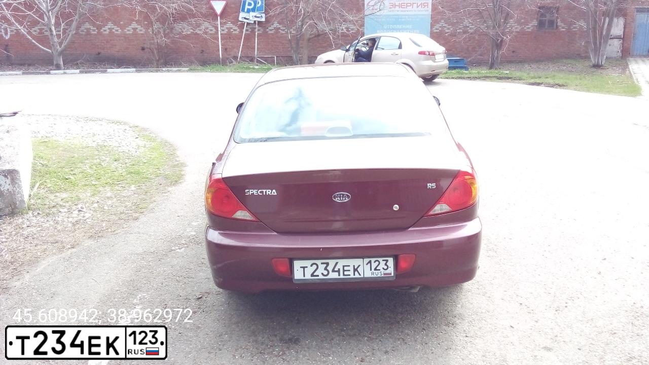 Фото автомобиля KIA SPECTRA, 2009 — госномер Р012РЕ199. Цвет: КРАСНЫЙ ПЕРЕЦ