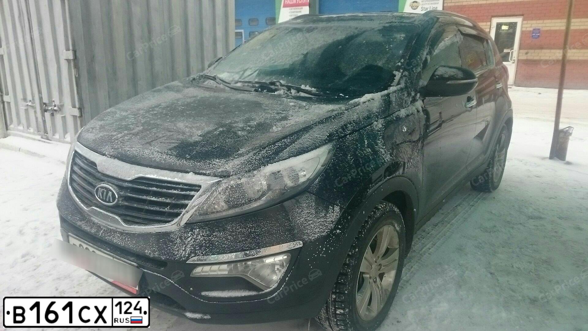 Фото автомобиля KIA SPORTAGE, 2012 — госномер Х379КВ65. Цвет: ЧЕРНЫЙ ПЕРЛАМУТР