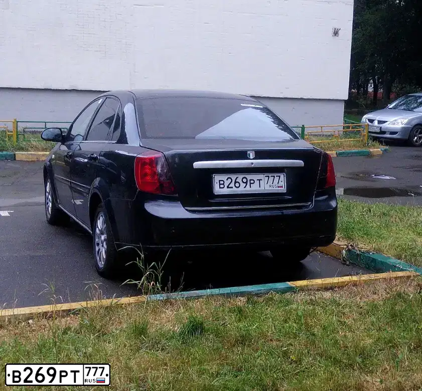 Фото автомобиля CHEVROLET LACETTI, 2008 — госномер К907УР21. Цвет: ЧЕРНЫЙ