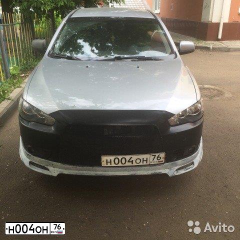 Фото автомобиля MITSUBISHI LANCER, 2007 — госномер Н004ОН76. Цвет: СВЕТЛО-СЕРЫЙ