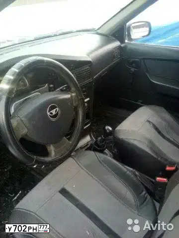 Фото автомобиля DAEWOO O NEXIA, 2012 — госномер В411ТТ190. Цвет: ЧЕРНЫЙ