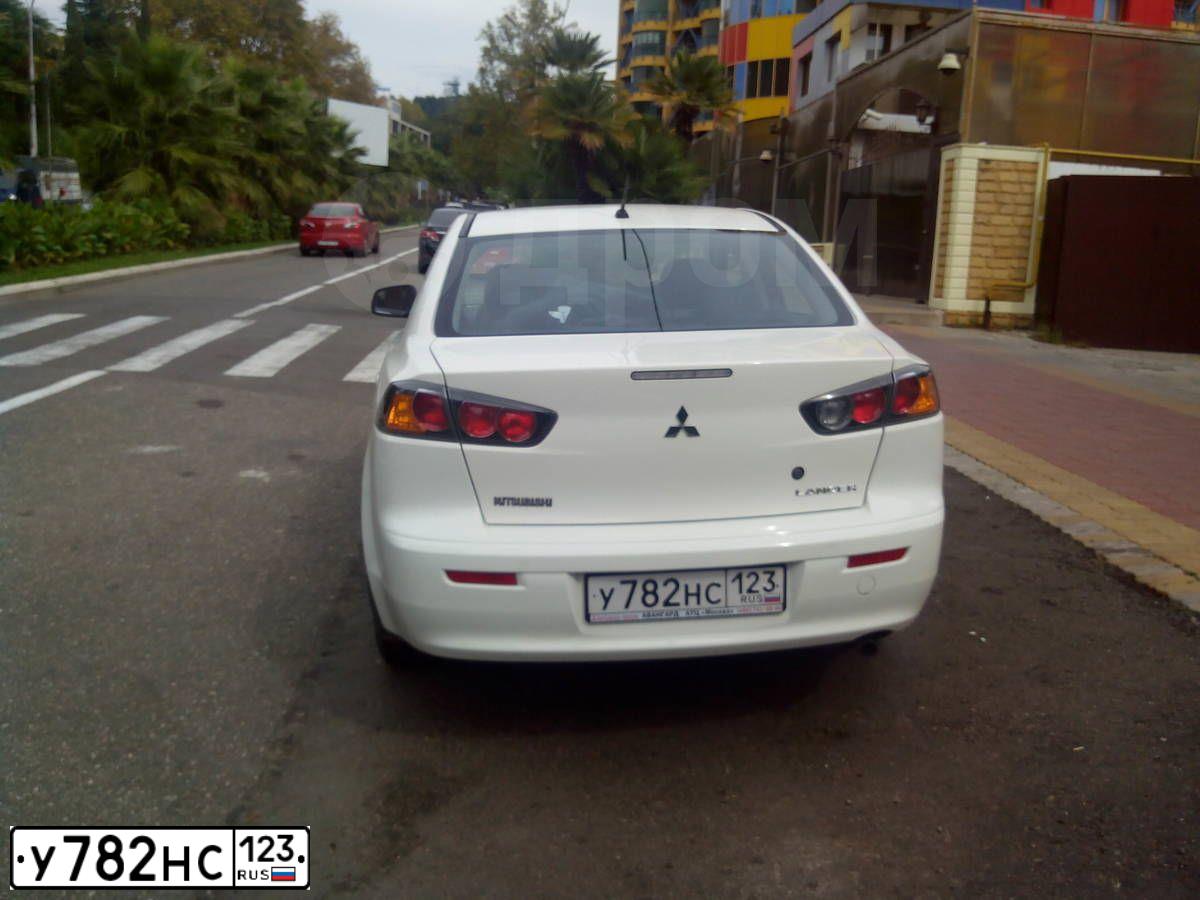 Фото автомобиля MITSUBISHI LANCER, 2013 — госномер А948КН196. Цвет: Белый