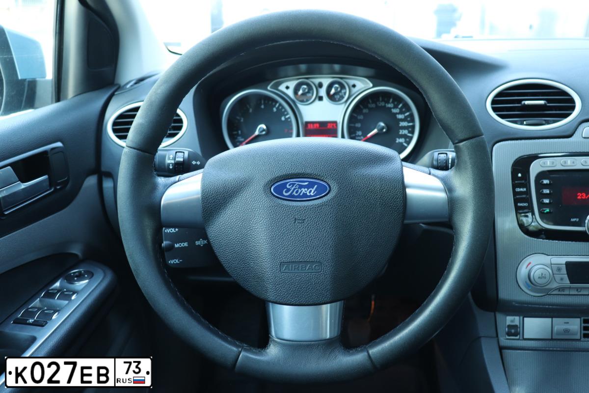 Фото автомобиля FORD FOCUS, 2010 — госномер К027ЕВ73. Цвет: СЕРО-ГОЛУБОЙ