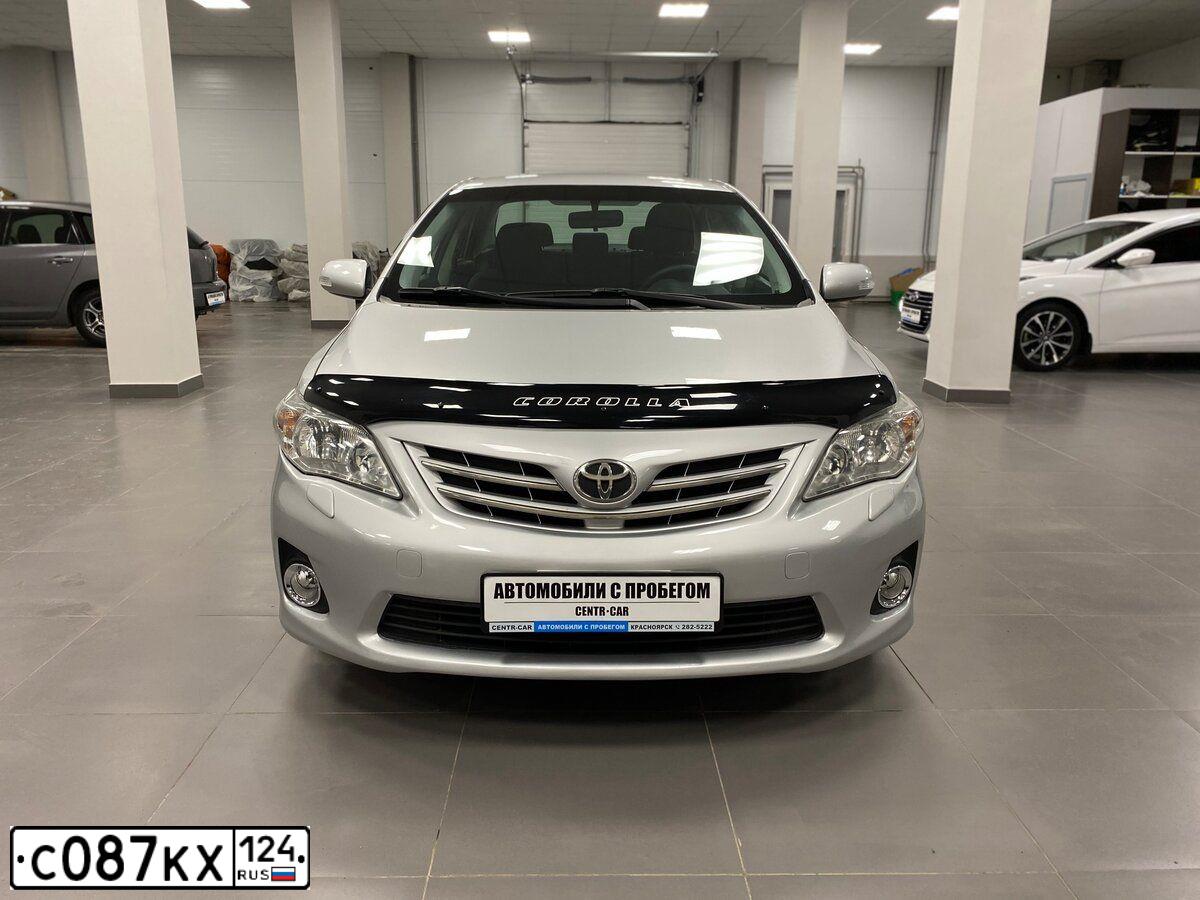 Фото автомобиля TOYOTA COROLLA, 2010 — госномер Н155СМ124. Цвет: СЕРЕБРИСТЫЙ